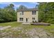 The back yard features a deck with chairs, grill, and well maintained lawn at 1506 Southwick Dr, Johns Island, SC 29455