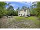Expansive backyard featuring a fire pit area, ample green space, and a view of the home at 1506 Southwick Dr, Johns Island, SC 29455