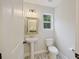 Half-bath featuring pedestal sink and decorative tile flooring at 1506 Southwick Dr, Johns Island, SC 29455