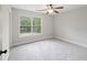 Bright bedroom featuring a ceiling fan and a large window with a view of the outdoors at 1506 Southwick Dr, Johns Island, SC 29455