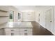 Dining area featuring hardwood floors, modern chandelier, and easy access to the kitchen and the backyard at 1506 Southwick Dr, Johns Island, SC 29455