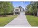 Charming two-story home with well-maintained lawn, driveway and attached one car garage at 1506 Southwick Dr, Johns Island, SC 29455