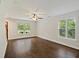 Bright living room with hardwood floors and large windows that provide natural light at 1506 Southwick Dr, Johns Island, SC 29455