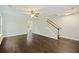 Bright living room with hardwood floors, ceiling fan and staircase to the upper level at 1506 Southwick Dr, Johns Island, SC 29455