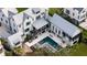 Stunning aerial view of a modern home with a backyard pool and outdoor living spaces at 156 Nobels Point St, Charleston, SC 29492