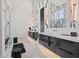 Modern bathroom features black vanities with marble floors and countertops, exuding style and sophistication at 156 Nobels Point St, Charleston, SC 29492