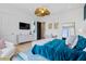 Stylish bedroom featuring a blue accent wall, chandelier, and modern furnishings at 156 Nobels Point St, Charleston, SC 29492