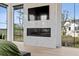 Bright bedroom features a fireplace, large windows with serene views, and neutral tones for a relaxing space at 156 Nobels Point St, Charleston, SC 29492