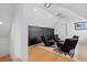 Bonus room featuring hardwood flooring, a custom area rug, and stylish lounge chairs at 156 Nobels Point St, Charleston, SC 29492