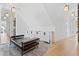 Bonus room with vaulted ceiling, ample built-in storage, and a black leather chaise lounge at 156 Nobels Point St, Charleston, SC 29492