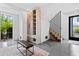 Modern entryway has a black leather bench, coat storage, and stairs at 156 Nobels Point St, Charleston, SC 29492