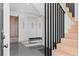 An entryway features modern coat storage, a black bench, and stairs at 156 Nobels Point St, Charleston, SC 29492