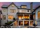 Luxury home featuring an outdoor kitchen and bar area, in-ground pool, and lots of natural light at 156 Nobels Point St, Charleston, SC 29492