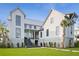 Close up of modern two story exterior featuring concrete steps, professional landscape, and manicured lawn at 156 Nobels Point St, Charleston, SC 29492