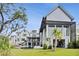 Stunning modern home featuring an in-ground pool, manicured lawn, and an open-air patio with lots of natural light at 156 Nobels Point St, Charleston, SC 29492
