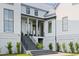 Beautiful modern two story exterior featuring concrete steps, professional landscape, and manicured lawn at 156 Nobels Point St, Charleston, SC 29492
