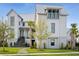 Charming two-story home with a lush green lawn, professional landscaping, and modern architectural elements at 156 Nobels Point St, Charleston, SC 29492