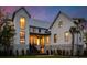 Stunning two-story home featuring a manicured lawn and contemporary design with large windows at 156 Nobels Point St, Charleston, SC 29492