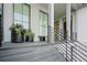 Stylish front porch with slate steps, metal railings, and black flower pots enhancing curb appeal at 156 Nobels Point St, Charleston, SC 29492