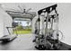 Well-equipped home gym featuring a treadmill, weight machine, and scenic outdoor views at 156 Nobels Point St, Charleston, SC 29492