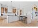 Bright, modern kitchen with marble counters, sleek cabinetry, and a large island with seating at 156 Nobels Point St, Charleston, SC 29492