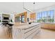 Modern kitchen with marble islands, wooden cabinetry, and an open design to the dining and living areas at 156 Nobels Point St, Charleston, SC 29492