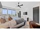 Bright main bedroom featuring large windows, ceiling fan, and contemporary furnishings at 156 Nobels Point St, Charleston, SC 29492