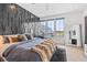 Bright main bedroom with stylish paneled accent wall, large windows, and modern decor at 156 Nobels Point St, Charleston, SC 29492