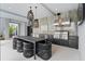 This outdoor kitchen features a built-in grill, sink, ample counter space, and a dining area for entertaining at 156 Nobels Point St, Charleston, SC 29492
