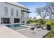 Backyard pool area featuring a modern lounge space, outdoor seating, and lush greenery at 156 Nobels Point St, Charleston, SC 29492
