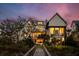 Beautiful waterfront home with large windows, inviting outdoor spaces, and a private walkway at 156 Nobels Point St, Charleston, SC 29492