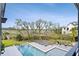 An aerial view showcases the sparkling swimming pool and surrounding marsh views from the backyard at 156 Nobels Point St, Charleston, SC 29492