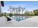A refreshing swimming pool is surrounded by lounge chairs and lush landscaping, perfect for relaxation at 156 Nobels Point St, Charleston, SC 29492