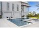 The backyard features a modern swimming pool and sleek lounge area, ideal for relaxation and outdoor enjoyment at 156 Nobels Point St, Charleston, SC 29492