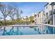 Enjoy the inviting swimming pool, complemented by a spacious patio and manicured lawn at 156 Nobels Point St, Charleston, SC 29492