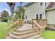 Inviting backyard deck features wooden stairs and railings, perfect for outdoor entertaining at 16 Oatly Cir, Charleston, SC 29414