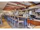Inviting bar area with wood beams, hanging lights, and ample seating at the counter at 16 Oatly Cir, Charleston, SC 29414