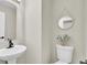 Half bath featuring pedestal sink, updated lighting, and decorative wall decor at 16 Oatly Cir, Charleston, SC 29414