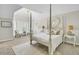 Primary bedroom boasts a four poster bed, vaulted ceiling, and serene, neutral decor at 16 Oatly Cir, Charleston, SC 29414
