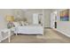Bright bedroom featuring a four-poster bed, neutral tones, and access to ensuite bathroom at 16 Oatly Cir, Charleston, SC 29414