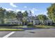 Beautiful clubhouse with well-maintained landscaping, a manicured lawn and lush, mature shade trees at 16 Oatly Cir, Charleston, SC 29414