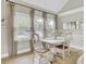 Cozy dining area features a charming table setting with natural light from the nearby window at 16 Oatly Cir, Charleston, SC 29414