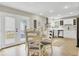 Cozy dining area with patio access, complemented by hardwood floors and natural light at 16 Oatly Cir, Charleston, SC 29414