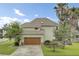 Charming two-story home with an attached garage and lush, green lawn at 16 Oatly Cir, Charleston, SC 29414