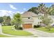Charming two-story home with an attached garage and lush, green lawn at 16 Oatly Cir, Charleston, SC 29414