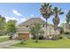 Charming two-story home with an attached garage and lush, green lawn at 16 Oatly Cir, Charleston, SC 29414