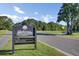 Community golf course and driving range entrance sign amidst beautiful trees and open sky at 16 Oatly Cir, Charleston, SC 29414