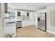Modern kitchen features white cabinetry, stainless steel appliances, and ample countertop space at 16 Oatly Cir, Charleston, SC 29414