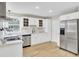 Bright kitchen featuring stainless steel appliances, white cabinets, and butcher block countertops with hardwood floors at 16 Oatly Cir, Charleston, SC 29414