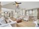 Open-concept living area boasts vaulted ceilings, a staircase and ample natural light at 16 Oatly Cir, Charleston, SC 29414